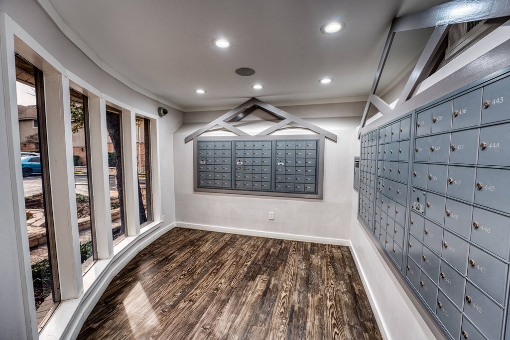a wine cellar with a wooden floor and glass doors